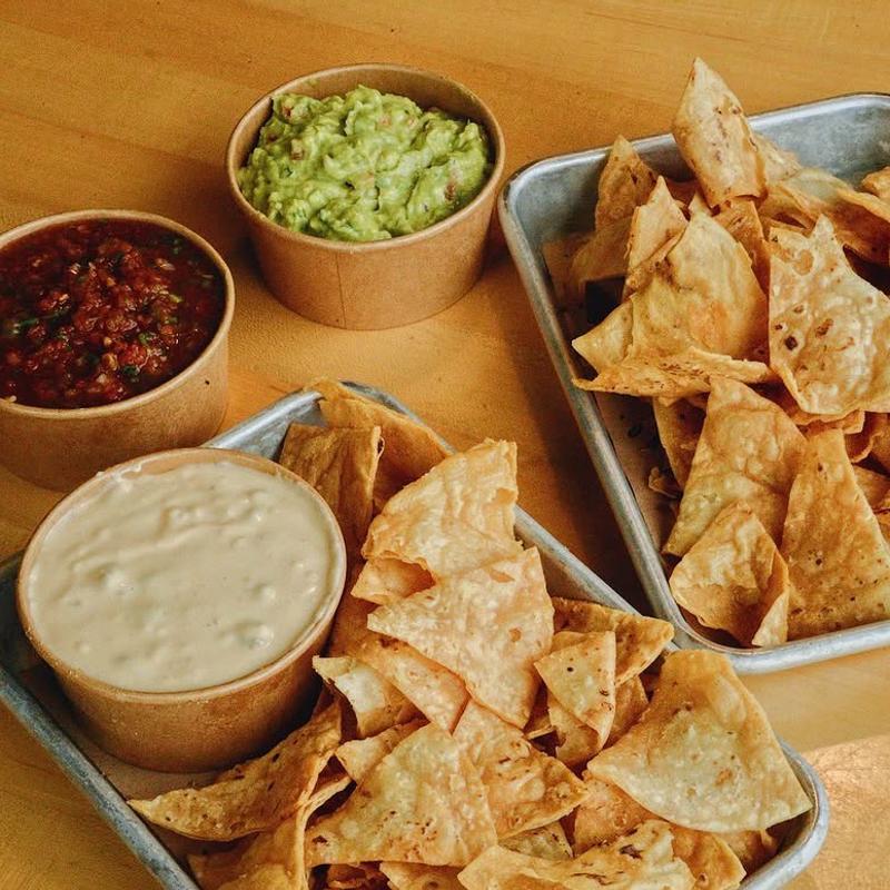 Chips, salsa, guacamole and queso
